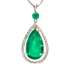 A lab grown emerald, diamond and 18k white gold necklace