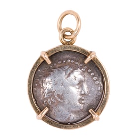 An ancient coin and 14k gold pendant