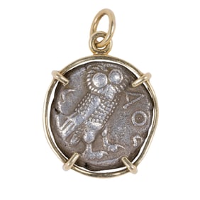 A Roman coin and 14k gold pendant
