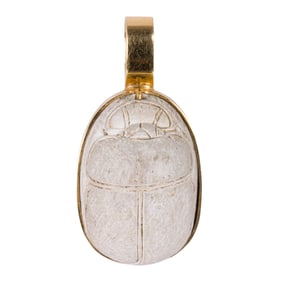 An antique scarab and 14k gold pendant
