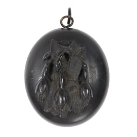 A Victorian gutta percha mourning locket