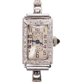 A diamond and platinum and 14k white gold Hofbros watch