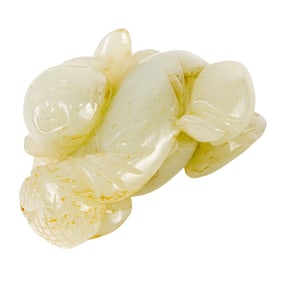 A Chinese celadon jade carving of a boy