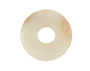 A Chinese white jade huan pendant