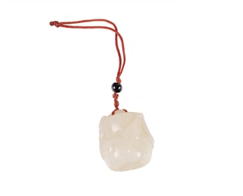 A Chinese white jade pumpkin toggle