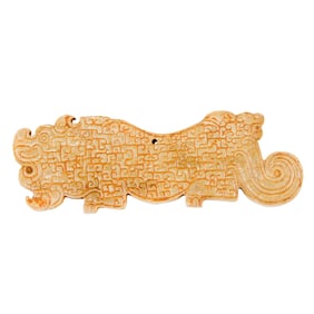 A Chinese white jade beast pendant