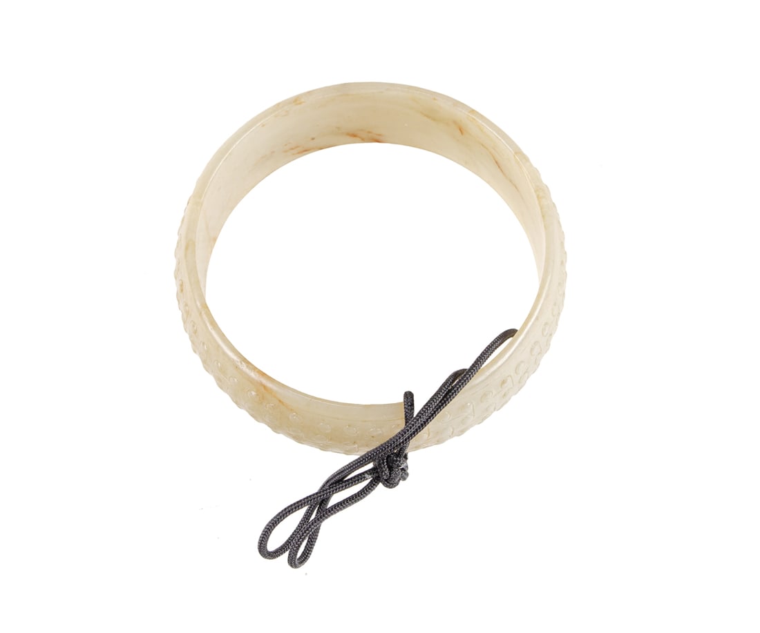 A Chinese celadon jade bangle bracelet (1 of 3)