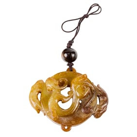 A Chinese russet jade 'chilong' pendant