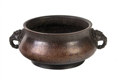 A Chinese parcel-gilt bronze handled censer