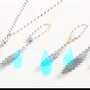 A turquoise and silver earring and necklace set: A turquoise and silver earring and necklace setA pair of earrings featuring carved turquoise drops measuring approximately 16.7 x 8.33 mm; a necklace featuring a carved turquoise drop measuring approx