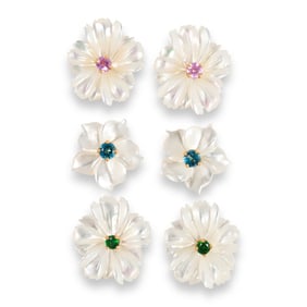 A group of mother of pearl and fourteen karat gold earrings