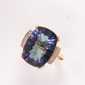 A treated quartz and 14k gold ring