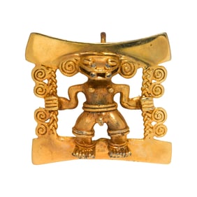 A gold plated reproduction Aztec pendant