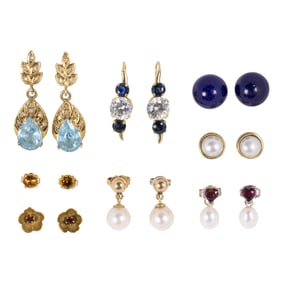 A group of gemstone and gold earrings