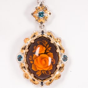 A carved amber, topaz and silver ring and necklace set