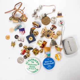 A group of pins, keys, and coins