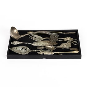 A lot of Rococo Revival 800 standard silver serving pieces comprised of (7) assorted serving pieces;