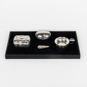 A four piece assembled group of sterling and silverplate articles