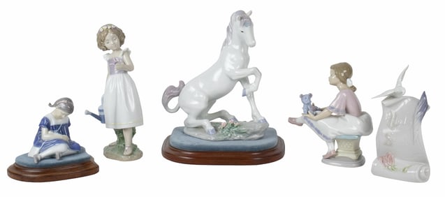 A group of five Lladro porcelain figures, comprising a unicorn, children and Lladro Society banner