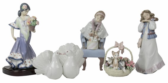 A five-piece collection of Lladro porcelain figures of doves, kittens, women and others