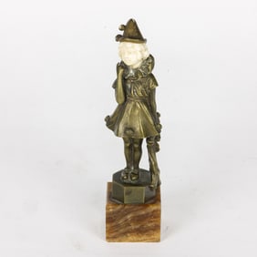 An Austrian Art Deco small bronze figure of a child as a pierrot on onyx base