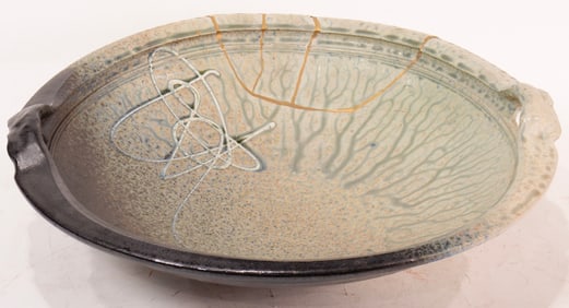 A Richard Aerni ash glaze stoneware handled bowl