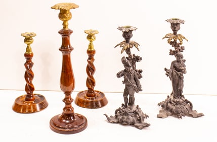 An assembled group of candlesticks and lighting accessories