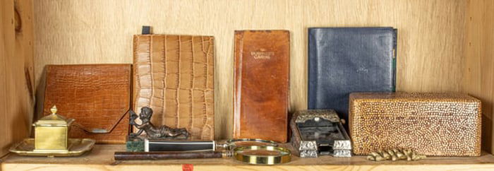 An assembled group of desk articles including magnifying glasses