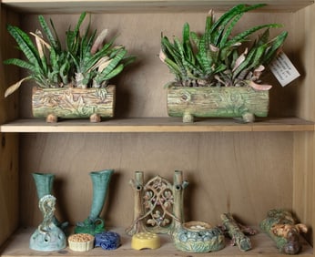 An assembled group of Weller pottery mainly from the Woodcraft line