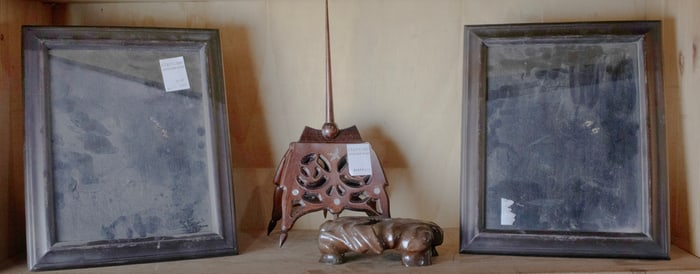 An assembled group of desk articles including a stand and pair of frames