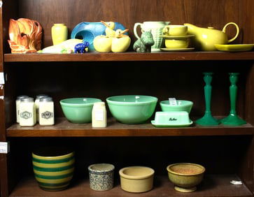 An assembled group of pottery and glass, including jadite, McCoy and Roseville