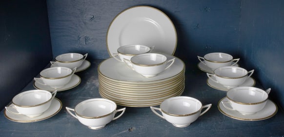 Twenty nine pieces of English Minton porcelain dinner service in the Golden Heritage pattern