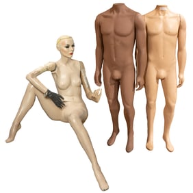 A group of three vintage department store mannequins