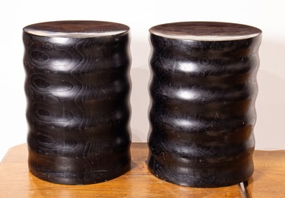 Two black painted round wood stools