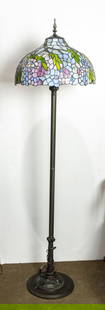 A vintage Tiffany style leaded glass floor lamp: A vintage Tiffany style leaded glass floor lamp, 66" high