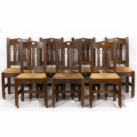 A set of eight Arts and Crafts dining side chairs
