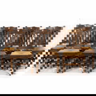 A set of eight Arts and Crafts dining side chairs: A set of eight Arts and Crafts oak dining chairs, likely Grand Rapids, circa 1910, comprising (1) armchairs and (7) side chairs, each having a heart cut out at crest, with a drop in rush seat, and ris