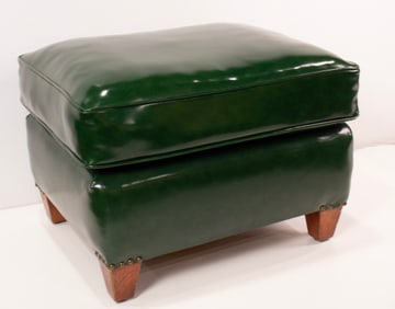 A green leather upholstered ottoman, 16"h x 23