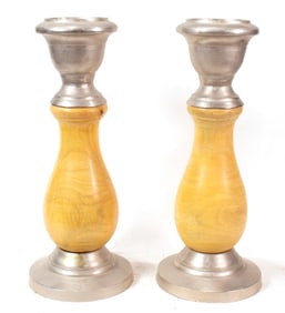 A pair of wood and aluminum candlesticks