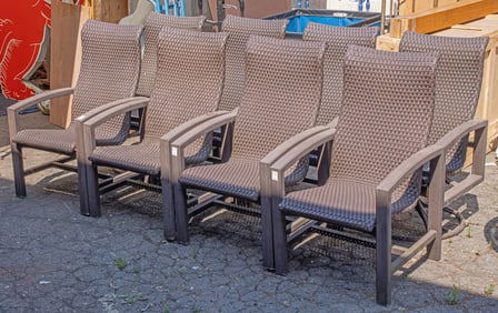 An outdoor patio set comprising eight metal arm chairs with woven faux leather/cord upholstery, two