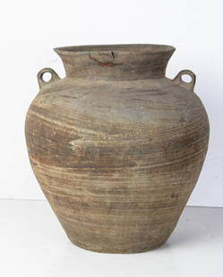 A Southeast Asian pottery jar: A Southeast Asian pottery jar. 13.375" high.