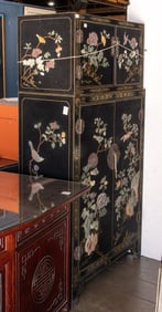 A Chinese black lacquered hardstone inlaid two-section cabinet