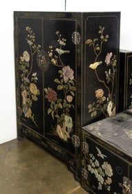 A Chinese black lacquered and hardstone inlaid cabinet