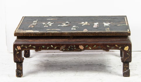 A Chinese mother-of-pearl and stone inlaid lacquered low table