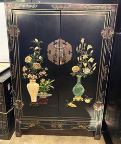 A Chinese black lacquered hardstone inlaid cabinet