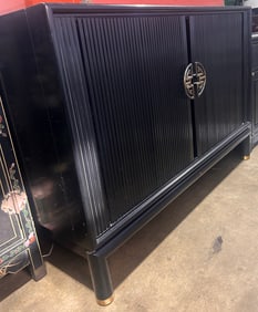 A Chinese black lacquered cabinet