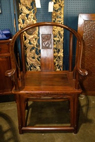 A pair of Chinese mixed-wood horseshoe-back armchairs
