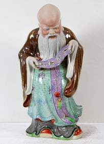 A Chinese famille rose 'shoulao' standing figure