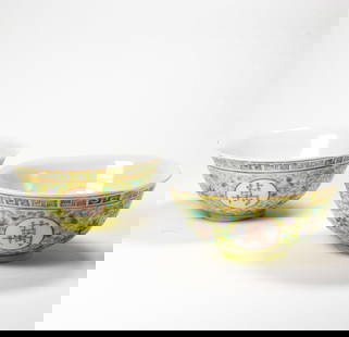 (lot of 2) Chinese famille rose yellow-ground bowls: (lot of 2) Chinese famille rose yellow-ground bowls. Featuring longevity character encircled by floral designs, bearing Guangxu six-character mark, Republic period, 4.625" across.