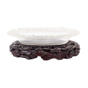 A Chinese carved glass bowl